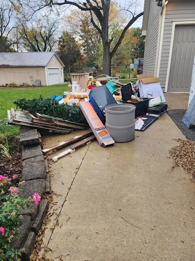 Dumpster being loaded with debris for Roofing Dumpster Rental in Festus